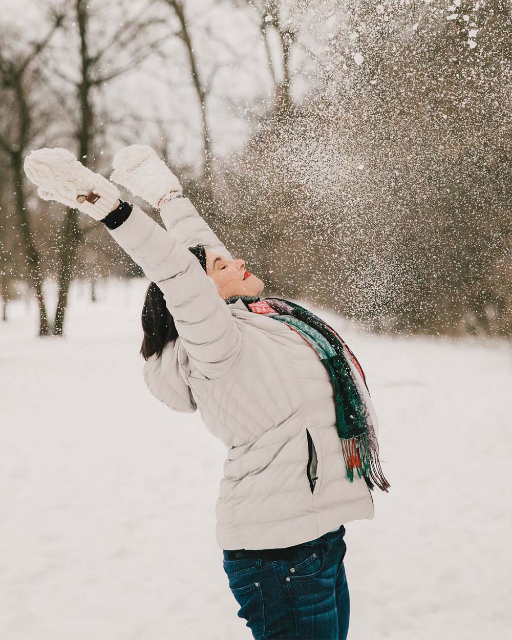 christine-trimpe-speaker-author-weight-loss-coach-home-what-to-expect-background Image of Christine in the winter, with her arms above her head after throwing snow